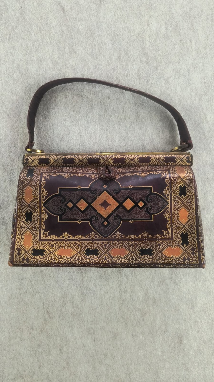 Vintage Florentine style gold embossed leather handbag
